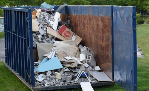 Waste management workers optimizing collection routes in West London