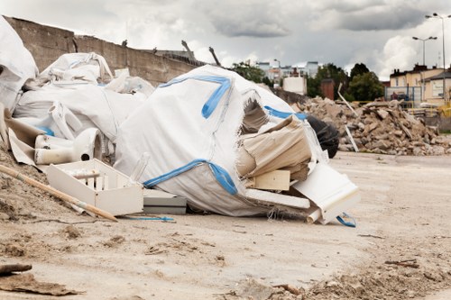 Team of removal experts preparing a sofa for transport